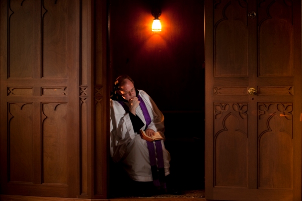 Fr. Bede Price, OSB in a newly installed confessional at the Oratory of Ss. Gregory and Augustine.